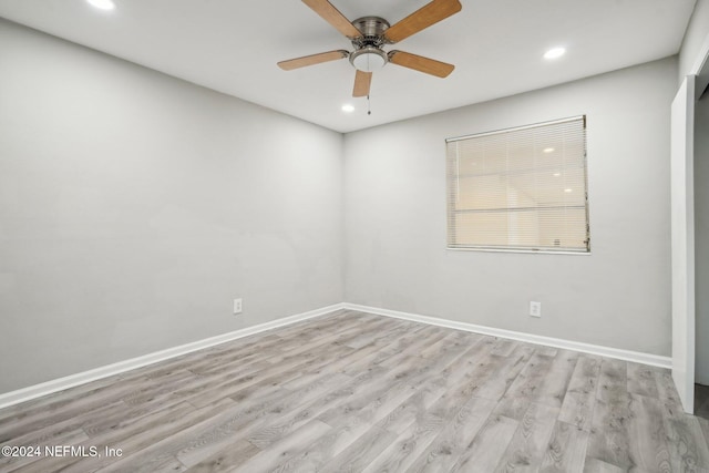 empty room featuring light hardwood / wood-style floors and ceiling fan