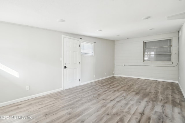 spare room featuring light hardwood / wood-style flooring