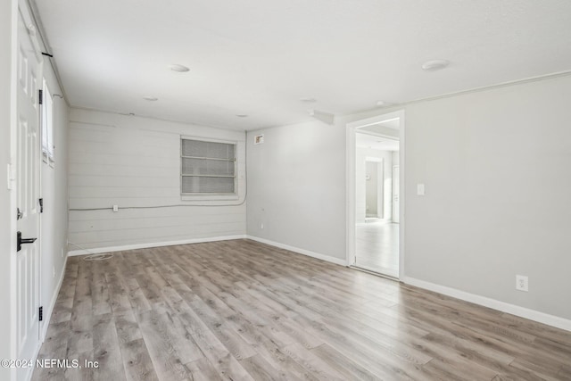 spare room with light hardwood / wood-style flooring