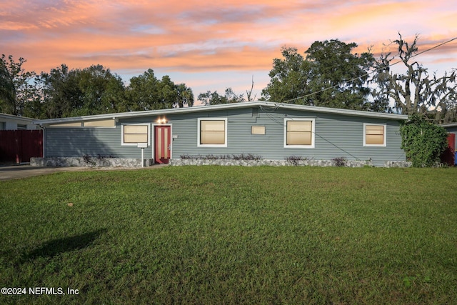 view of front of home with a lawn