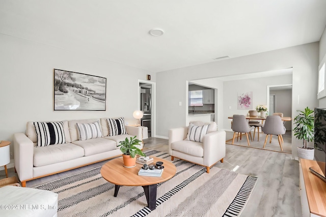 living room with light hardwood / wood-style floors