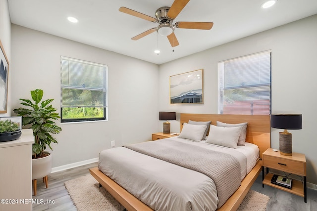 bedroom featuring ceiling fan and light hardwood / wood-style flooring