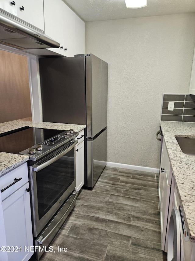 4836 Atlantic Blvd Unit 106, Jacksonville, FL 32207 - kitchen featuring stainless steel electric range, exhaust hood, white cabinets, dark wood-style flooring, and a textured wall