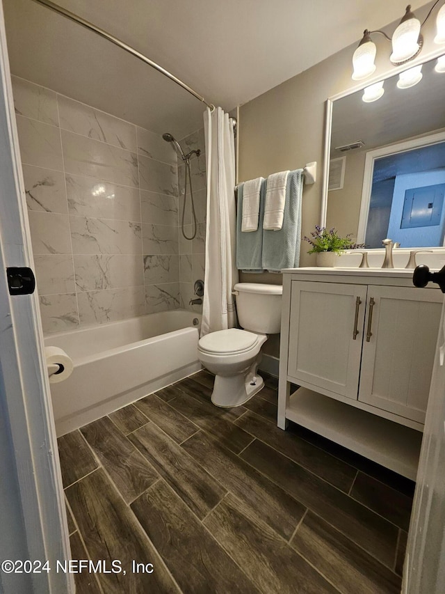 full bathroom with vanity, toilet, and shower / tub combo