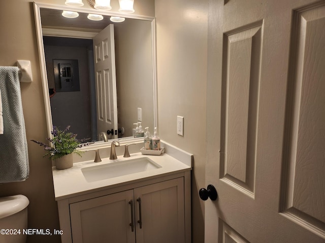 bathroom featuring vanity and toilet