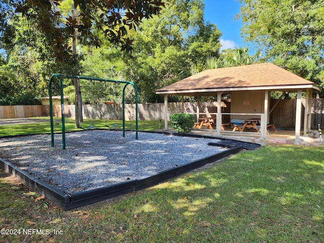 view of home's community with a gazebo, a lawn, and a playground