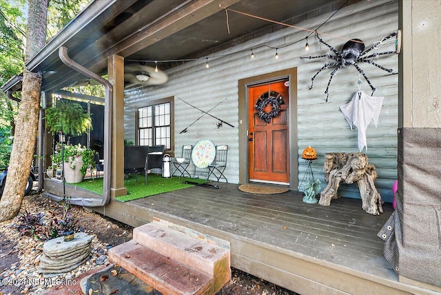 property entrance with a wooden deck