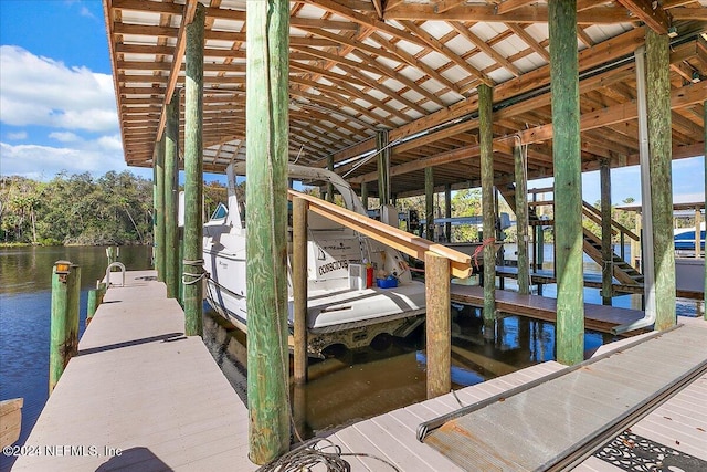 view of dock with a water view