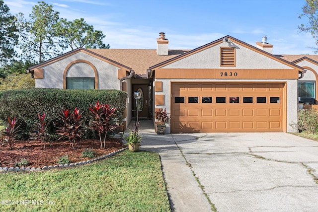 single story home featuring a garage