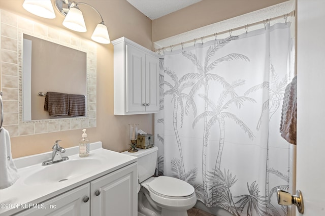 bathroom with vanity, a textured ceiling, a shower with curtain, and toilet