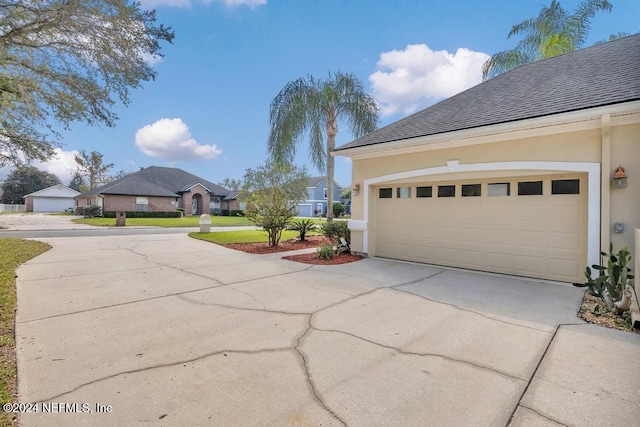 garage with a lawn