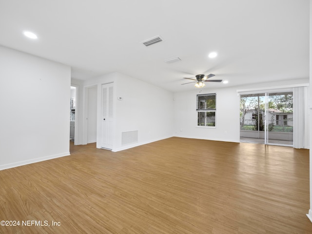 spare room featuring light wood-type flooring and ceiling fan