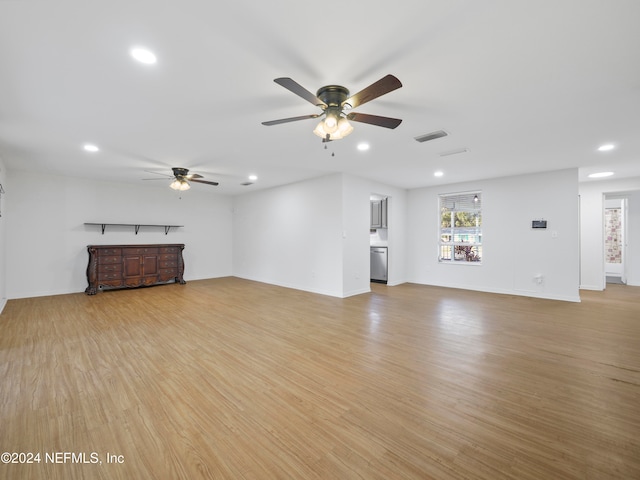 unfurnished living room with light hardwood / wood-style flooring and ceiling fan