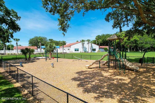 view of home's community featuring a playground