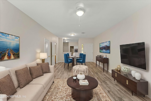 living room with light hardwood / wood-style flooring