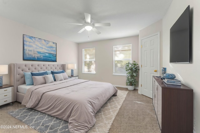 bedroom featuring ceiling fan and light colored carpet