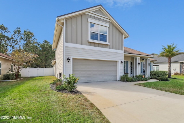 view of front of property featuring a front lawn and a garage