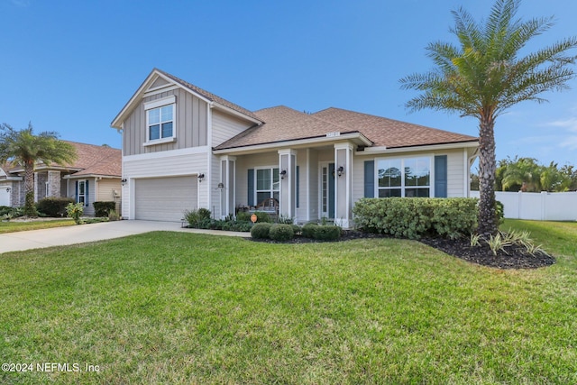 view of front of home with a front lawn and a garage