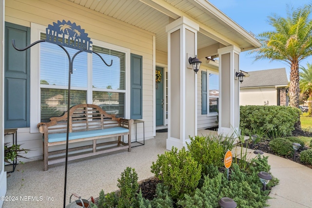 doorway to property with a porch