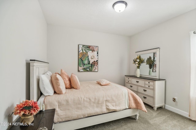 bedroom with light colored carpet