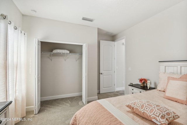 carpeted bedroom with a closet