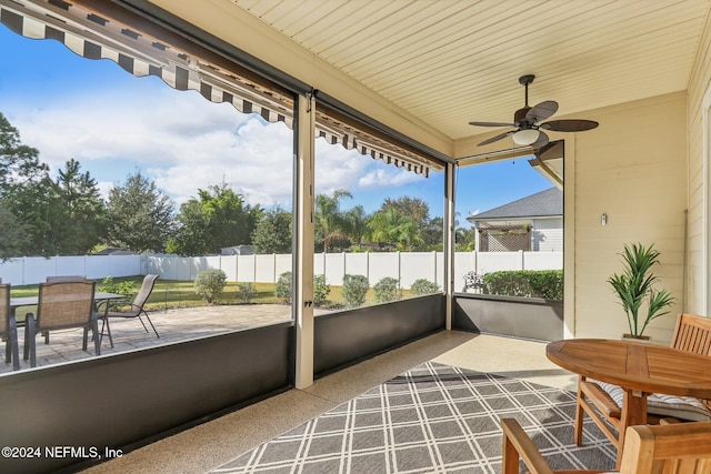 sunroom / solarium with ceiling fan