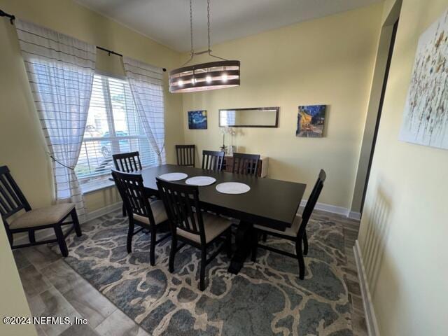 dining space with hardwood / wood-style flooring