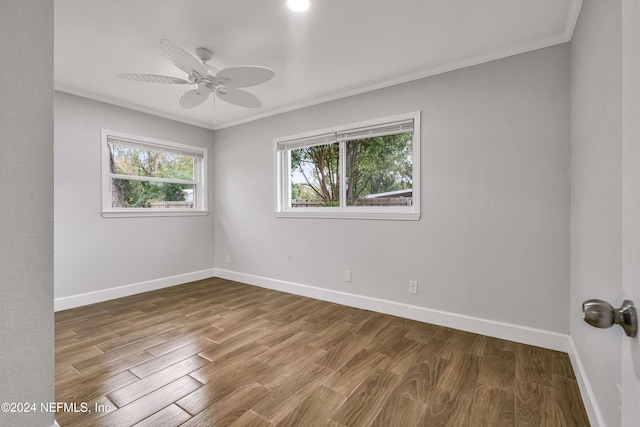 unfurnished room featuring hardwood / wood-style flooring, ceiling fan, and crown molding