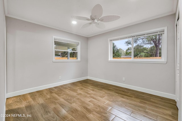 unfurnished room featuring ceiling fan, ornamental molding, and light hardwood / wood-style flooring