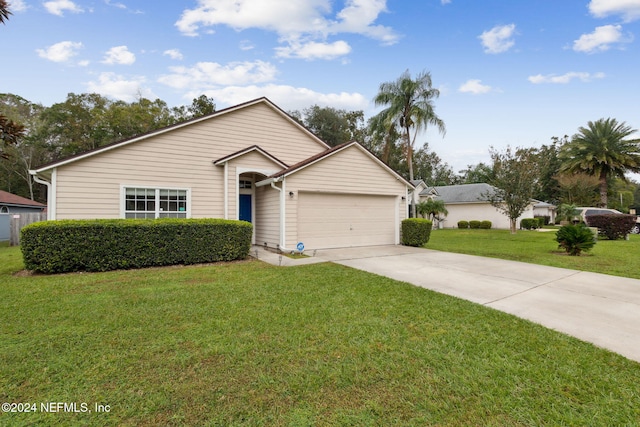 view of front of house with a front lawn and a garage