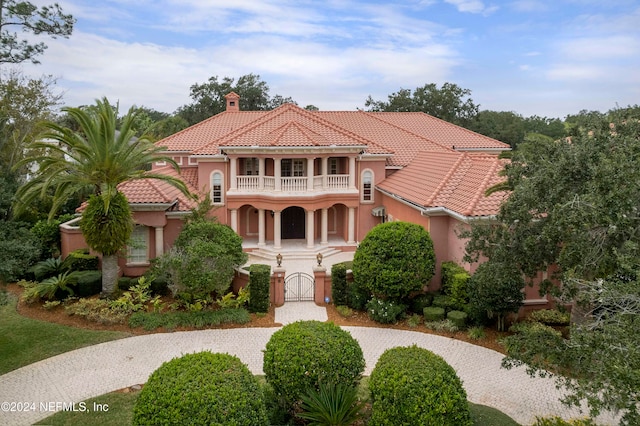 mediterranean / spanish-style home with a balcony