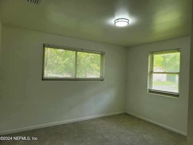 unfurnished room featuring carpet flooring