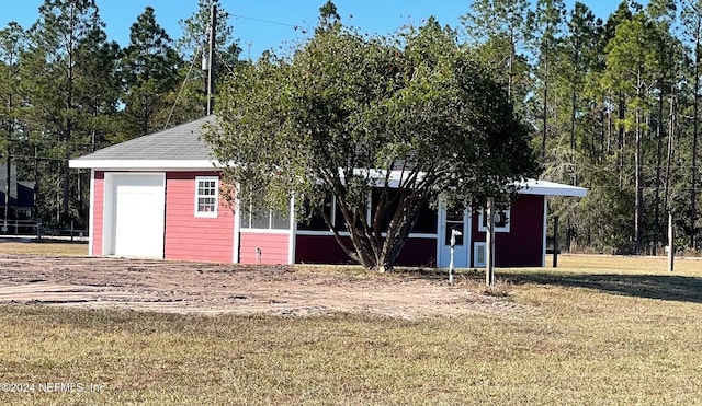 view of outbuilding with a lawn