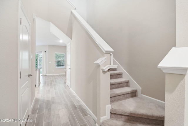 stairway featuring hardwood / wood-style floors