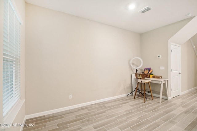 office space with light hardwood / wood-style flooring