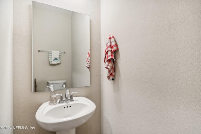 bathroom with toilet and sink