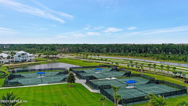 aerial view featuring a water view and a view of trees