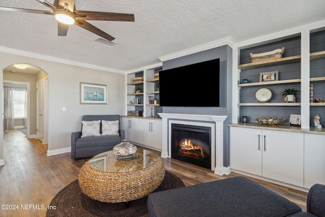 living room featuring crown molding, a textured ceiling, and dark hardwood / wood-style floors