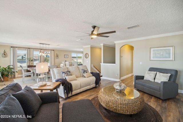 living room with ornamental molding, a textured ceiling, wood-type flooring, and ceiling fan with notable chandelier