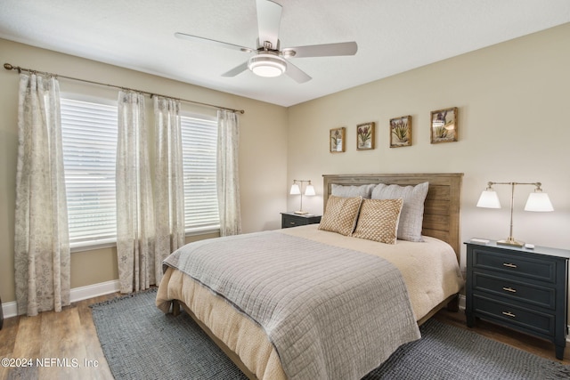 bedroom featuring dark wood-type flooring and ceiling fan