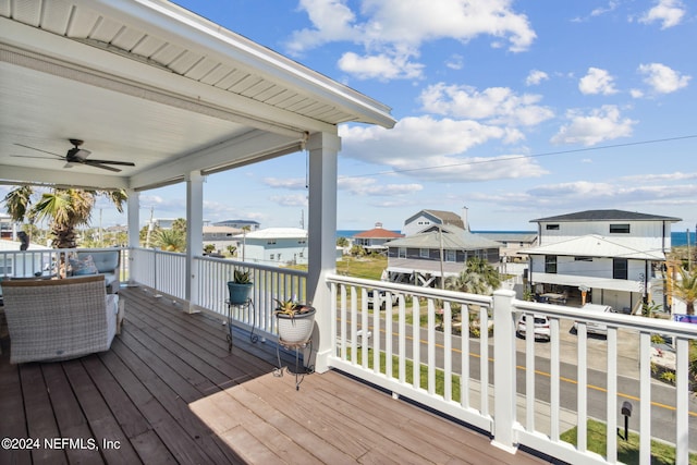 wooden deck featuring ceiling fan