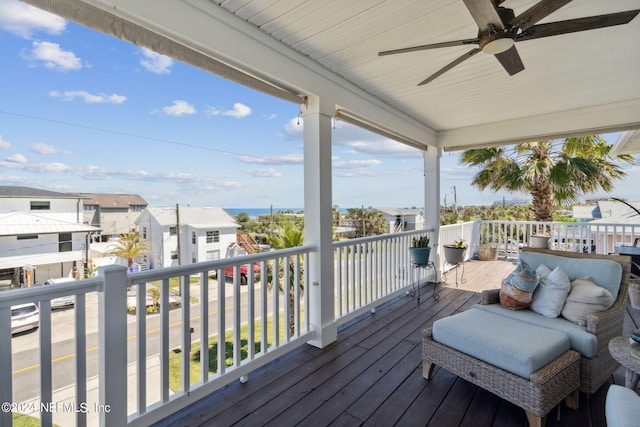 wooden terrace featuring ceiling fan