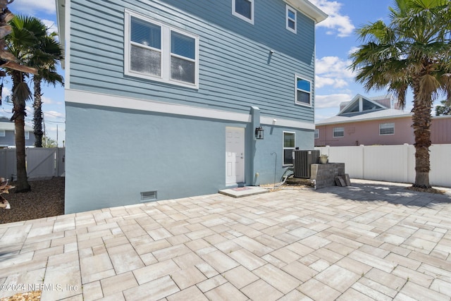 back of house with a patio area and cooling unit