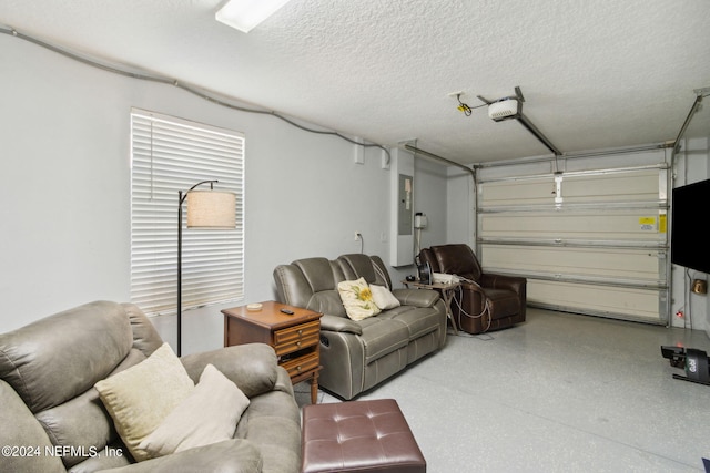 garage with a garage door opener and electric panel