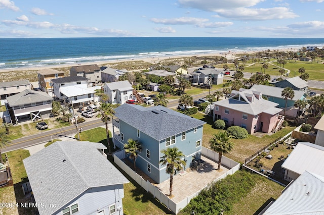 drone / aerial view with a water view and a view of the beach