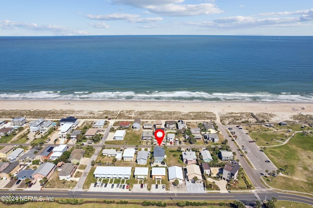 drone / aerial view with a view of the beach and a water view