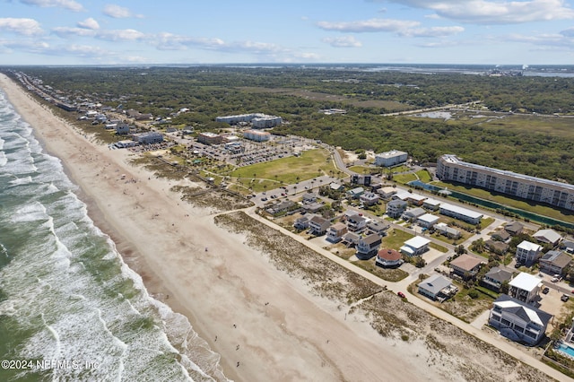 drone / aerial view featuring a view of the beach and a water view