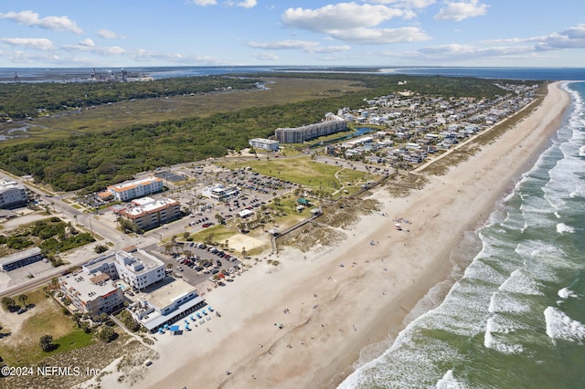 birds eye view of property with a water view and a view of the beach