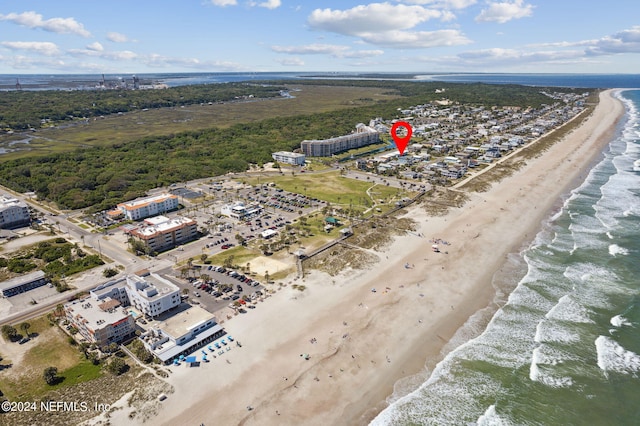 drone / aerial view featuring a water view and a beach view