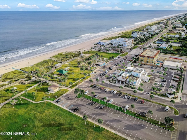 birds eye view of property featuring a view of the beach and a water view